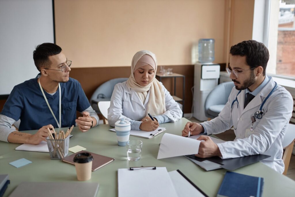 Medical Specialists Communicating at Meeting