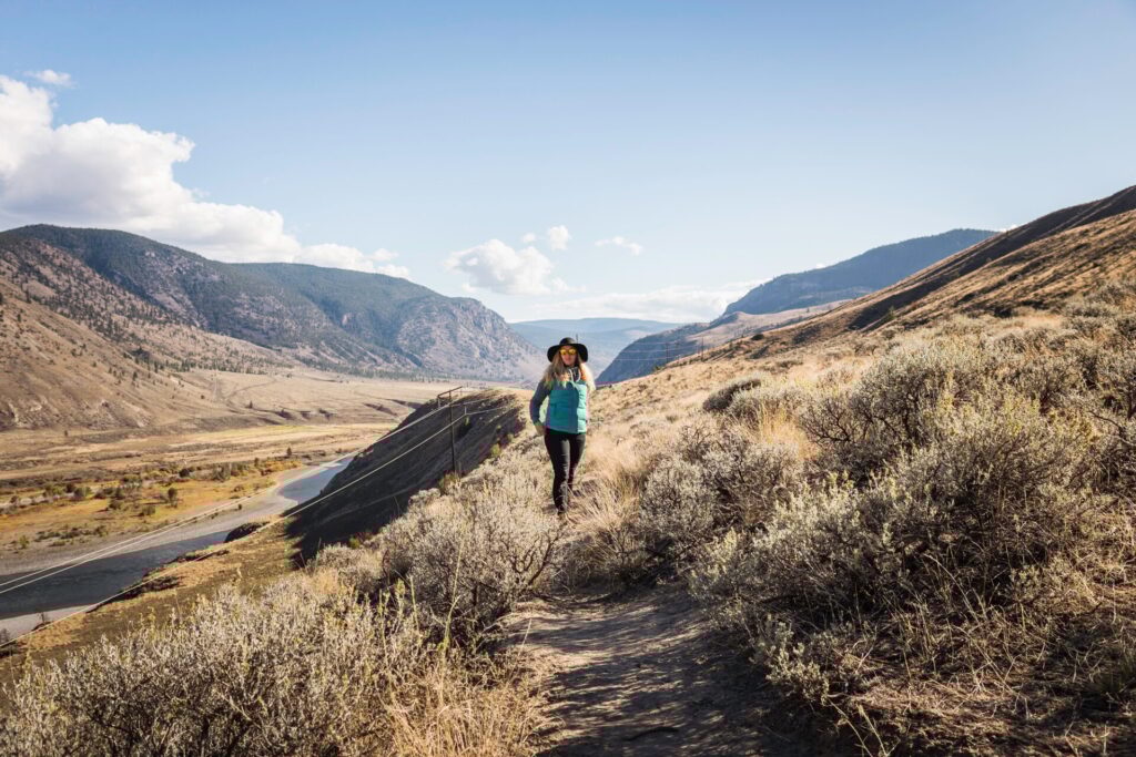 Woman hiking, Trans Canada Highway, near Kamloops, Boston Flats, British Columbia, Canada